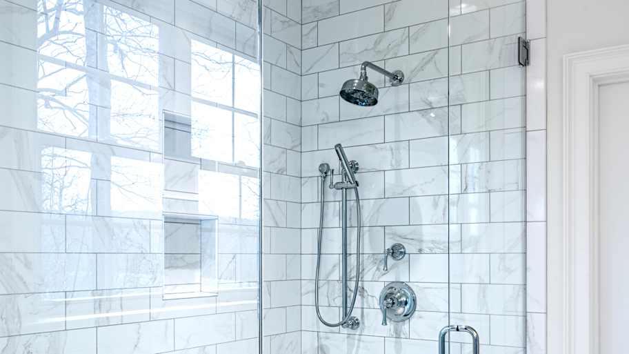 Modern bathroom with glass door.